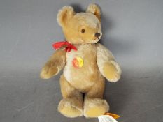 Steiff - An unboxed Steiff mohair bear #001253, standing approximately 30cms in height.