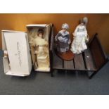 A vintage scratch built wooden dolls bed measuring approximately 62cms (H) x 48cms (W) x 64cms (L)