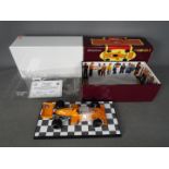 Carousel - A boxed 1:18 scale McLaren M16 1974 Indianapolis 500 winner number 3 Johnny Rutherford