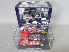 Fly - 2 x MAN trucks from the Super Trucks slot car range including a chrome finish version # 08051,