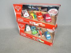 Pixar - Cars - 2 x different Race Day Fan four car sets # BJT08, # BJT10.