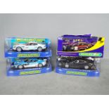 Scalextric - A collection of 4 x Aston Martin DBS and DBR9 models including a Top Gear car,