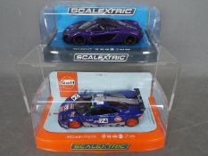 Scalextric - 2 x McLaren slot cars, an F1 GTR in Gulf livery, # C3969 and a P1 in purple # C3842.