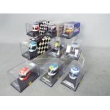 Minichamps - A collection of 9 x 1:8 scale Formula One racing drivers helmets including Damon Hill,