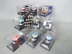 Minichamps - A collection of 9 x 1:8 scale Formula One racing drivers helmets including Damon Hill,