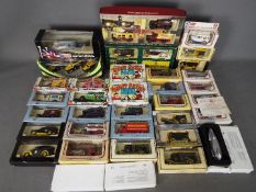 Lledo - Over 30 boxed diecast model vehicles in various scales by Lledo.
