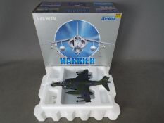 Armour Collection - A boxed 1:48 scale Harrier AV8B in U.S. Marines livery. # 98052.