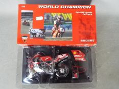 Minichamps - A 1:12 scale Ducati 996 Superbike World Champion Carl Fogarty.