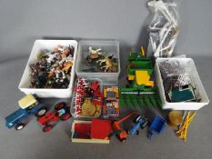 Britains - A small collection of unboxed Britains diecast farm vehicles and implements,
