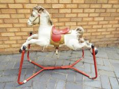 Mobo - A vintage Mobo Prairie King rocking horse on springs.