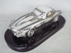 Silver Dreams - Jaguar E-Type series 3 roadster metal effect model in 1:18 scale.