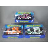 Scalextric - 3 x Ford Focus RS WRC models including two Eddie Stobart liveried cars and a 2010