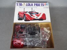Tamiya - A boxed 1:18 scale Tamiya #10004 Lola T-160 TS plastic model kit.