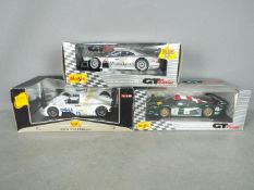 Maisto - Three boxed 1:18 scale diecast GT racing cars from Maisto.