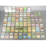 POKEMON - A collection of 57 Pokemon Base Set Cards.