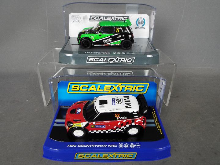 Scalextric - 2 x Mini models, a Countryman WRC driven by Kris Meeke,