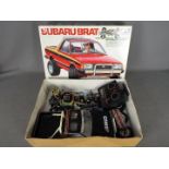 Tamiya - An assembled and boxed vintage 1983 release Tamiya #58038 1:10 scale R/C Subaru Brat