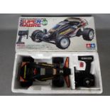 Tamiya - An assembled and boxed vintage 1988 Tamiya #46002 1:14 scale R/C Quick Drive Super Sabre