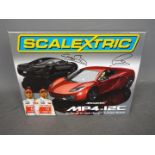 Scalextric - A limited edition McLaren MP4-12C set configured by Lewis Hamilton and Jenson Button.