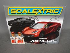 Scalextric - A limited edition McLaren MP4-12C set configured by Lewis Hamilton and Jenson Button.