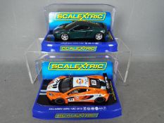 Scalextric - 2 x McLaren MP4-12C models,