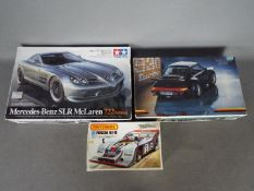 Matchbox, Fujimi, Tamiya - Three boxed plastic model car kits.