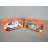 Slot-it - A brace of Porsche 911 GT1 EVO 98 slot cars one in black and gold Weissach test livery