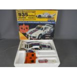 Sanwa - An assembled and boxed Sanwa SRC2500M 1:12 scale Ready to Run Porsche 935 Turbo Martini