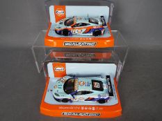 Scalextric - 2 x 2014 McLaren 12C GT3 cars from the Macau GT Cup series,