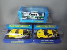 Scalextric - 3 x Chevrolet models, a Monte Carlo and 2 x Corvette C6R GT2 models,
