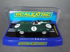 Scalextric - A Jaguar D type driven by Mike Hawthorn and Desmond Titterington at Dundrod in 1955.