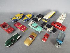 Dinky Toys, Corgi Toys, Matchbox - A collection of 14 unboxed diecast model vehicles.