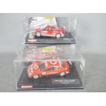 Carrera - Two boxed 1:32 scale Carrera Evolution slot cars.