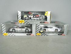 Maisto - Three boxed 1:18 scale diecast GT racing cars from Maisto.