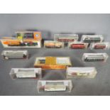 Fleischmann, Roco, Arnold - A siding of 13 boxed items of N gauge rolling stock.