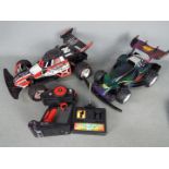 A Nikko Turbo Panther radio controlled car and controller together with a similar Artin Midnight