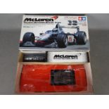 Tamiya - A boxed Tamiya #58235 1:10 scale McLaren Mercedes MP4/13 R/C High Performance Racing Car.