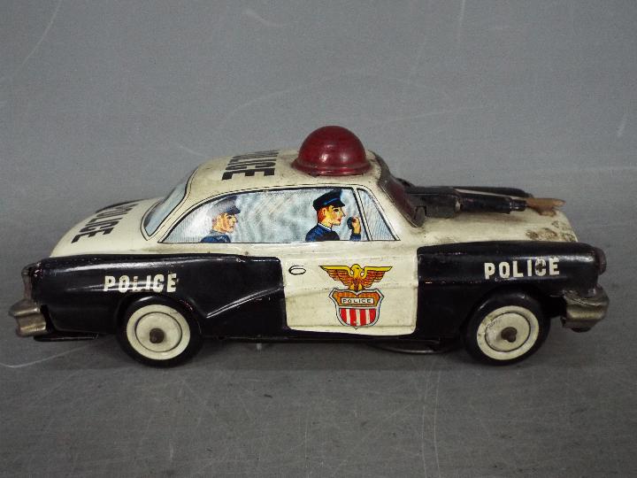 Yoshiya - An unboxed vintage Japanese tinplate 'Bump-N-Go' Police car by Yoshiya. - Image 2 of 4