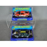 Scalextric - 2 x Lotus Evora models, a red,