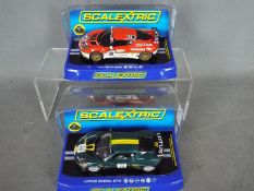 Scalextric - 2 x Lotus Evora models, a red,