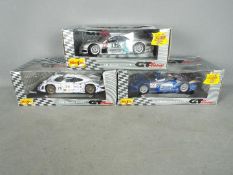 Maisto - Three boxed 1:18 scale diecast GT racing cars from Maisto.