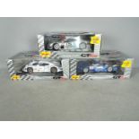 Maisto - Three boxed 1:18 scale diecast GT racing cars from Maisto.