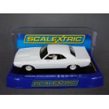 Scalextric - A Dodge Challenger in rare plain white livery # C3444 The car appears Mint in a Very