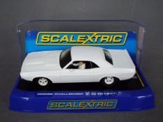 Scalextric - A Dodge Challenger in rare plain white livery # C3444 The car appears Mint in a Very