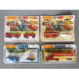 Matchbox - A collection of four carded Matchbox diecast vehicles.