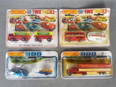 Matchbox - A collection of four carded Matchbox diecast vehicles.