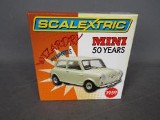 Scalextric - A limited edition Mini 50th Anniversary model. # C2980A.