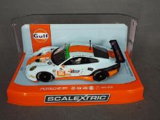 Scalextric - Rare 2015 Porsche 911 Gulf Racing Team car number 86 from the Silverstone 4 hour race.