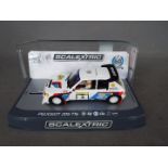 Scalextric - Limited edition 1985 Peugeot 205 T16 1000 Lakes Rally car as driven by Timo Salonen.