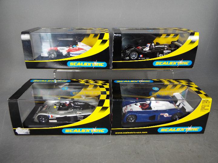 Scalextric - 4 x cars, a 2002 Toyota F1, 3 x Cadillac LMP cars. # C2455, # C2426T, # C2259, # C2340.